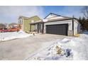 Home exterior with gray siding and snowy landscape at 5127 Cartland Dr, Indianapolis, IN 46239