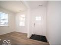 Bright foyer with vinyl plank flooring and access to other rooms at 6196 Granby Dr, Whitestown, IN 46075