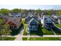Aerial view of a neighborhood with a gray craftsman home at 560 Jefferson Ave, Indianapolis, IN 46201