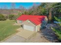 Single-story house with red metal roof and a spacious yard at 7209 Bean Blossom Rd, Morgantown, IN 46160