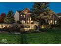 Brick house with manicured lawn at night at 11704 Gray Eagle Dr, Fishers, IN 46037