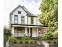 Beautiful two-story home featuring a classic design with a spacious front porch at 545 Fletcher Ave, Indianapolis, IN 46203