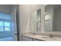 Bathroom featuring double sinks, modern fixtures, and plenty of counter space at 2170 Warbler St, Danville, IN 46122