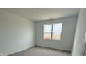 Cozy bedroom featuring neutral carpeting and a large window for natural light at 2170 Warbler St, Danville, IN 46122