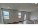 Bright living room with multiple windows and wood flooring at 2170 Warbler St, Danville, IN 46122