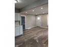 Open living room with new floors, recessed lighting, and neutral paint at 424 N Kealing Ave, Indianapolis, IN 46201