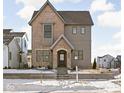 Two-story home with a charming brick and siding exterior at 1667 Midland Main St, Westfield, IN 46074