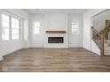 Spacious living room with fireplace and wood-look flooring at 1667 Midland Main St, Westfield, IN 46074