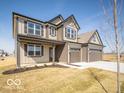 Charming two-story home with a welcoming porch and a two-car garage at 248 Highland Ave, Danville, IN 46122