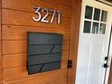 Modern black mailbox with house number 3271 on a wood background at 3271 Winthrop Ave, Indianapolis, IN 46205