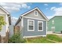 Charming home exterior with gray siding, white trim, and a fenced yard, perfect for relaxing at 359 Terrace Ave, Indianapolis, IN 46225