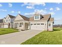 House exterior showcasing a front porch and landscaped yard at 3950 Bozeman Way, Bargersville, IN 46106