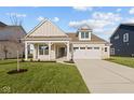 Two-story house with front porch, driveway and landscaping at 3950 Bozeman Way, Bargersville, IN 46106