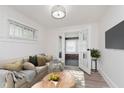 Cozy living room with comfortable seating, a large window, and stylish décor at 625 N Grant Ave, Indianapolis, IN 46201