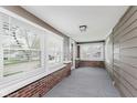 Relaxing porch with lots of natural light from large windows and durable brick accents at 625 N Grant Ave, Indianapolis, IN 46201