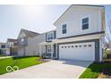 Two-story home with a two-car garage and a lush green lawn at 1573 Hanover St, Danville, IN 46122