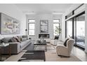 Bright living room boasts fireplace, plush seating, and sleek modern finishes at 17366 Newton Main St, Westfield, IN 46074