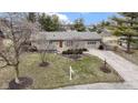 An elevated shot of a well-kept home with a manicured lawn and inviting curb appeal at 1024 N Michigan St, Greenfield, IN 46140