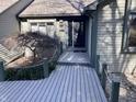 A welcoming front entrance with a wood walkway, small trees, and the house number displayed at 4660 W Cardinal Pt, Trafalgar, IN 46181
