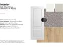 An interior door featuring a 2-panel textured arch, Pismo Knob Iron Black hardware, and Lantern Hill Driftwood Vinyl Plank flooring at 440 Atlas Dr, Lebanon, IN 46052