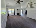 Inviting living room showcasing an open layout with a cozy fireplace, modern decor, and bright natural light at 6024 Boulder Dr, Anderson, IN 46013