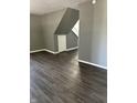 Spacious living room with modern flooring, neutral paint, and ample natural light creating a welcoming atmosphere at 2270 Wheeler St, Indianapolis, IN 46218