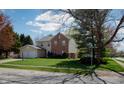 Attractive home with a two-car garage, inviting curb appeal, and a well-kept front yard at 9563 England Ct, Noblesville, IN 46060