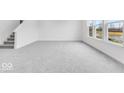 Cozy room featuring gray carpet, natural light, and backyard views at 1145 Bevy Blvd, Danville, IN 46122
