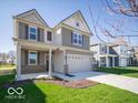 Inviting home with well-maintained lawn, covered porch, and convenient two-car garage at 1567 Hanover St, Danville, IN 46122