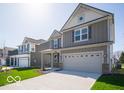 Attractive two-story home featuring a two-car garage and professionally landscaped front yard at 1567 Hanover St, Danville, IN 46122
