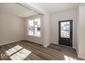 Bright and spacious living room with hardwood floors and large windows at 4958 Reavie Ct, Noblesville, IN 46062
