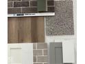 Home features various material samples, including brick, flooring, and cabinetry options at 16043 Meadow Frost Ct, Fishers, IN 46037