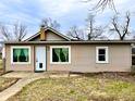 Charming single-story home with neutral siding, white trim, and a well-maintained front yard at 64 S 10Th Ave, Beech Grove, IN 46107