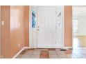 Front entry with tiled floor and white door at 230 S Central St, Atlanta, IN 46031