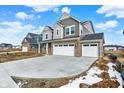 Stunning two-story home with a double garage, stone accents, and a spacious driveway in a residential area at 20397 Hudson Bay Ln, Westfield, IN 46074