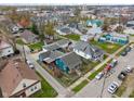 Aerial view showcases the blue house's location within the neighborhood and community at 323 E Franklin St, Shelbyville, IN 46176