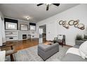 Cozy living room featuring a decorative fireplace, hardwood floors, and modern furniture at 610 N Drexel Ave, Indianapolis, IN 46201
