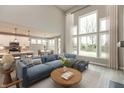 Spacious living room with high ceilings, large windows, and comfortable seating area at 6973 Oakdale Ln, Avon, IN 46123