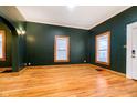 Living room features hardwood floors and an exterior door at 1715 Union St, Indianapolis, IN 46225