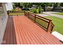 Spacious wooden deck with railings, perfect for outdoor enjoyment and entertaining guests at 6348 Kingsley Dr, Indianapolis, IN 46220