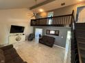 Spacious living room with high ceilings, modern tile flooring, and a cozy loft at 11720 Grenadier Ln, Indianapolis, IN 46229