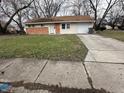 Brick and vinyl ranch home with attached garage and spacious yard at 3940 N Webster Ave, Indianapolis, IN 46226