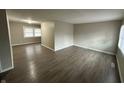 Spacious living room with grey wood-look flooring at 3940 N Webster Ave, Indianapolis, IN 46226