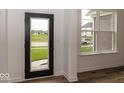Bright entryway showcasing a modern door and a window offering natural light at 6596 Dogwood Dr, McCordsville, IN 46055