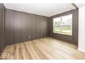 Elegant room featuring striking millwork, wood floors, and a bright, large window at 6596 Dogwood Dr, McCordsville, IN 46055