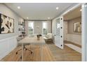 Stylish home office with modern desk, comfortable seating, and ample natural light for productivity at 7344 W County Road 600, McCordsville, IN 46055