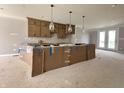 Kitchen installation in progress, featuring modern cabinets and pendant lighting at 7348 W County Road 600 Rd # 12-604, McCordsville, IN 46055