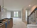 Spacious living room with lots of natural light and an open floor plan, under construction at 7348 W County Road 600 Rd # 12-604, McCordsville, IN 46055