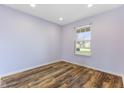 Bright bedroom with wood flooring and natural light from the exterior window at 800 Gondola Run, Greenfield, IN 46140