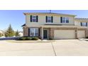 Two-story home with brick facade, attached garage, and well-maintained landscaping at 4007 Bullfinch Way, Westfield, IN 46062